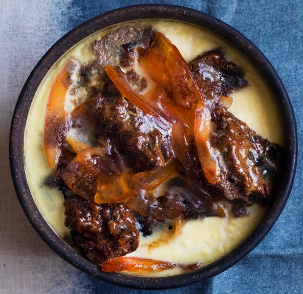 a bowl of marmalade malt loaf pudding in custard